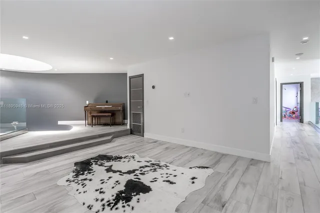 a bedroom with bed and a window