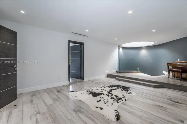 a bathroom with a sink mirror and vanity