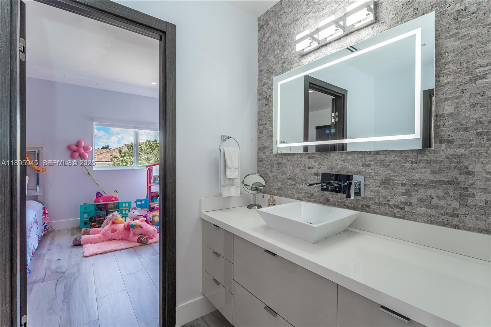 11531 Southwest 93rd Street Miami, FL 33176 - Photo 20 of 54 a bathroom with a sink mirror and vanity