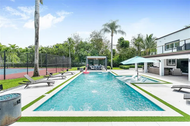 a view of a house with swimming pool