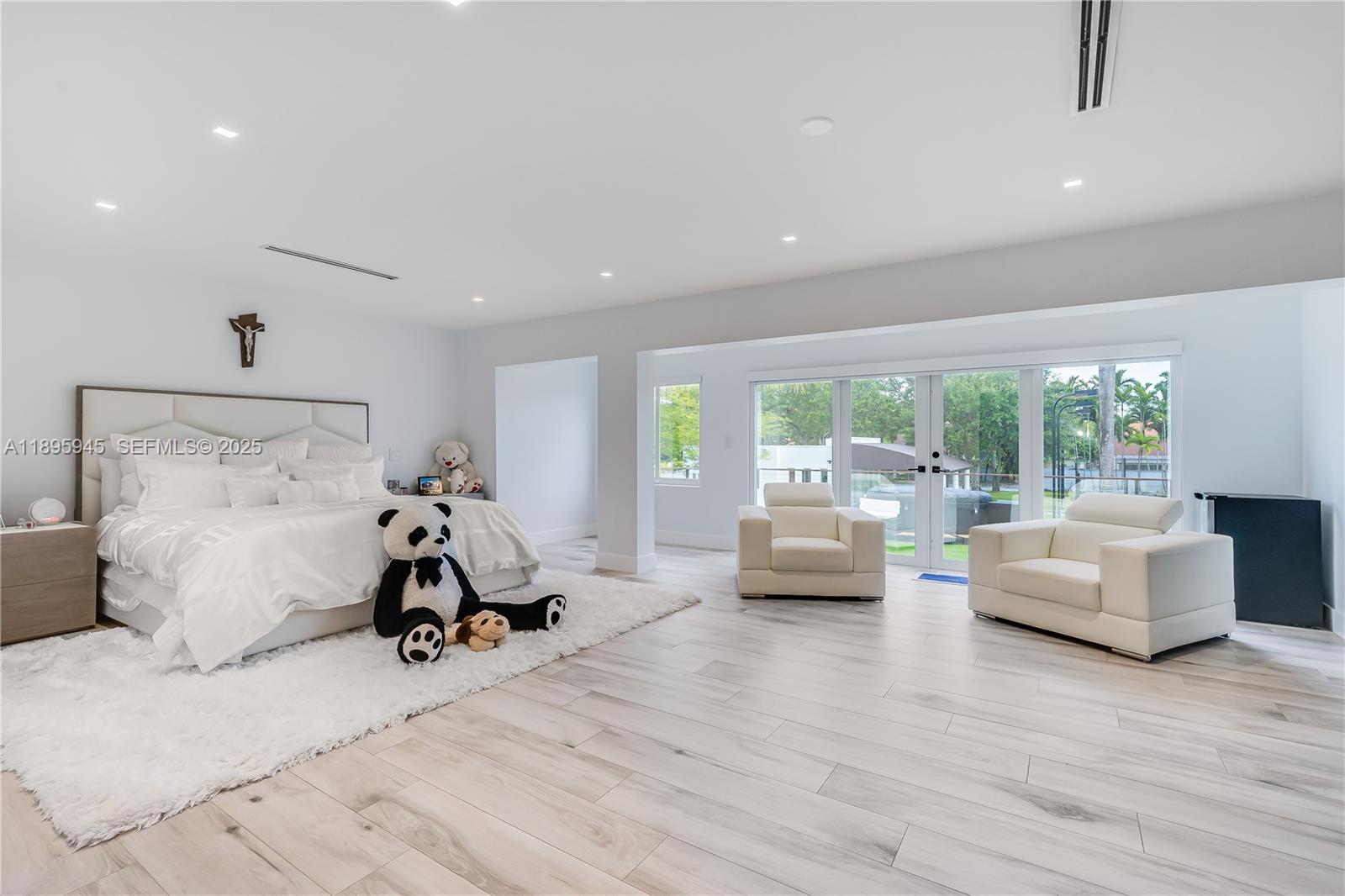 11531 Southwest 93rd Street Miami, FL 33176 - Photo 24 of 54 a bedroom with furniture and a large window