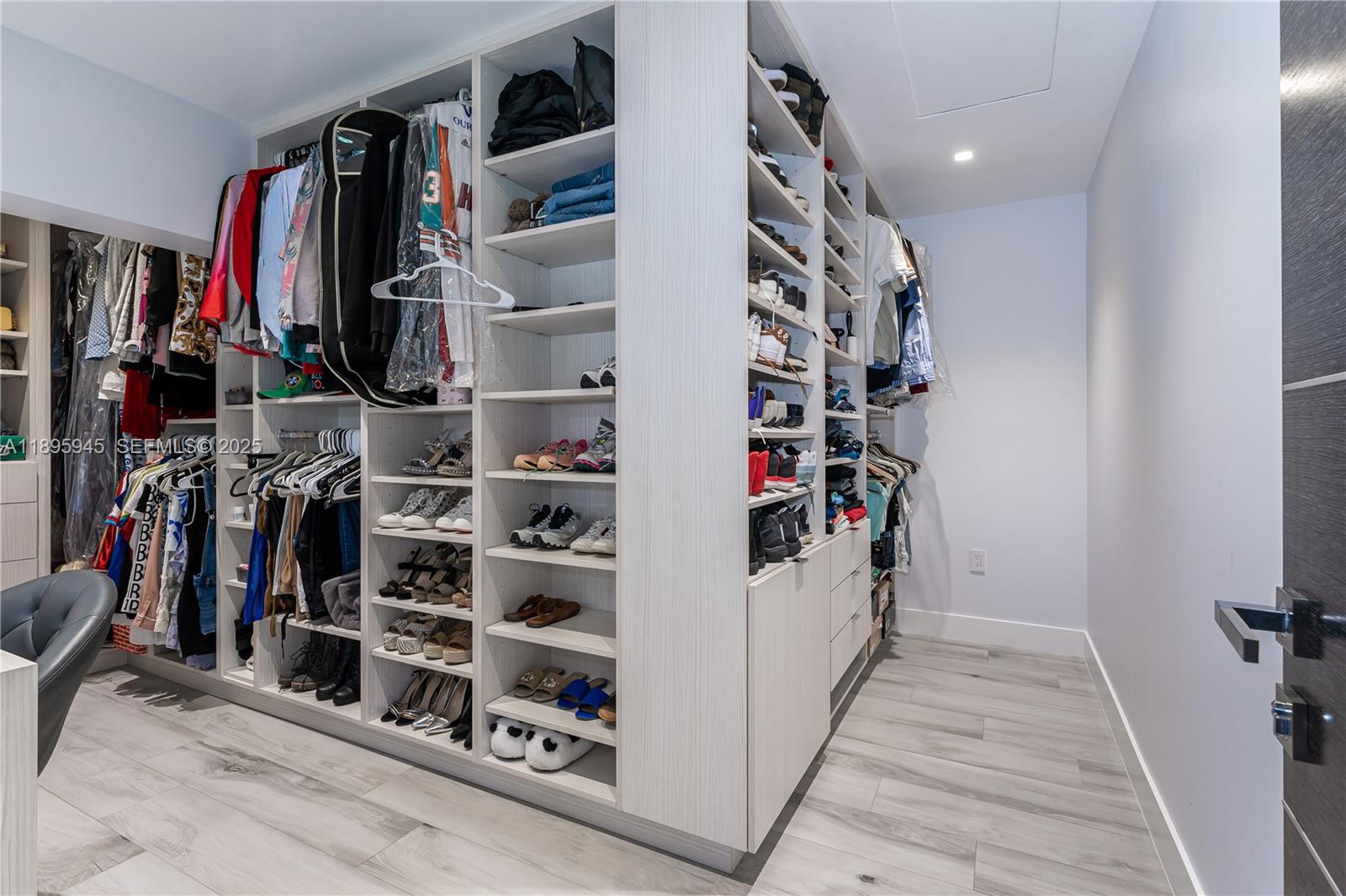 11531 Southwest 93rd Street Miami, FL 33176 - Photo 28 of 54 a view of walk in closet with clothes and shoes