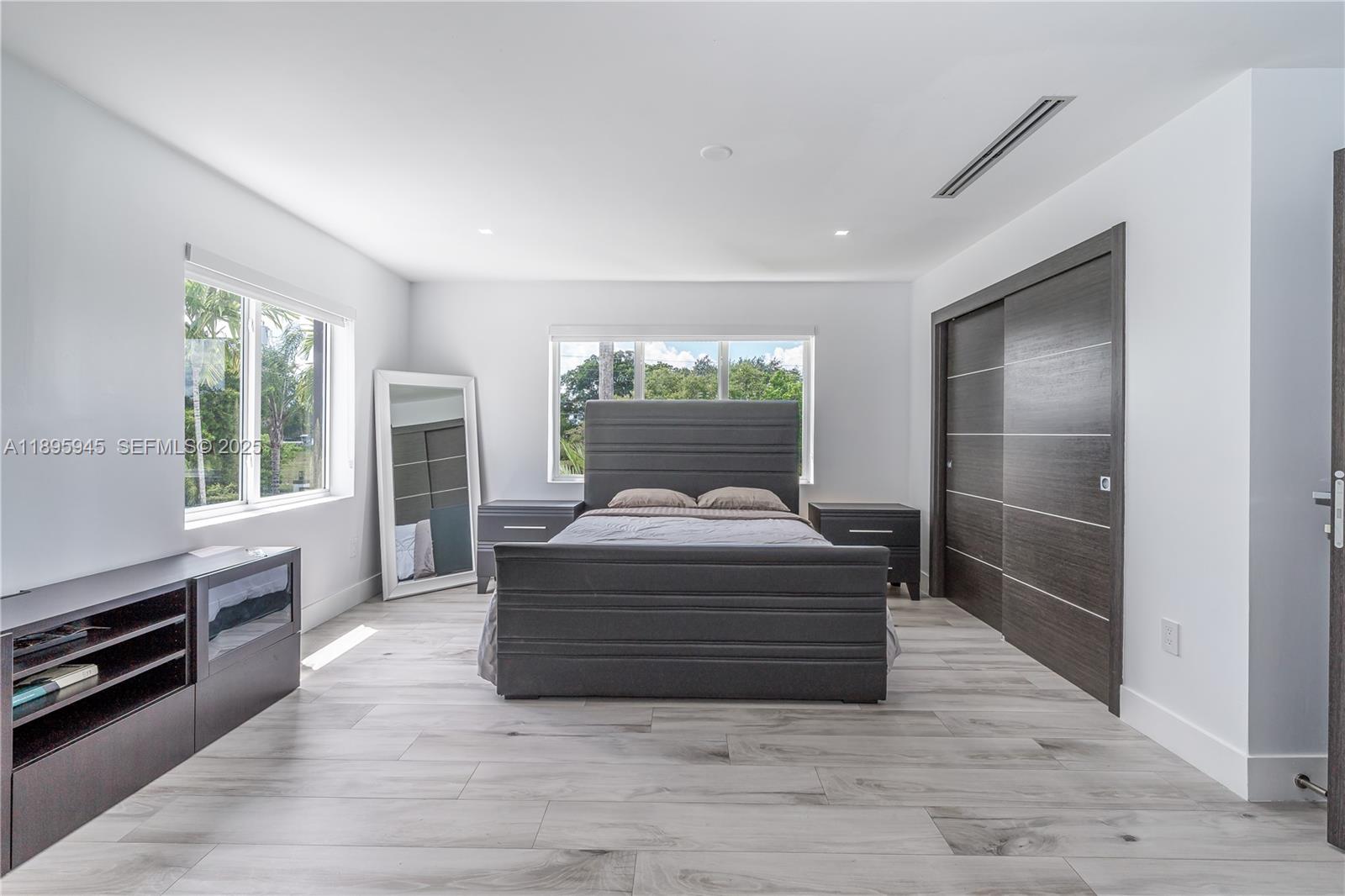 11531 Southwest 93rd Street Miami, FL 33176 - Photo 31 of 54 a view of livingroom with furniture window and wooden floor