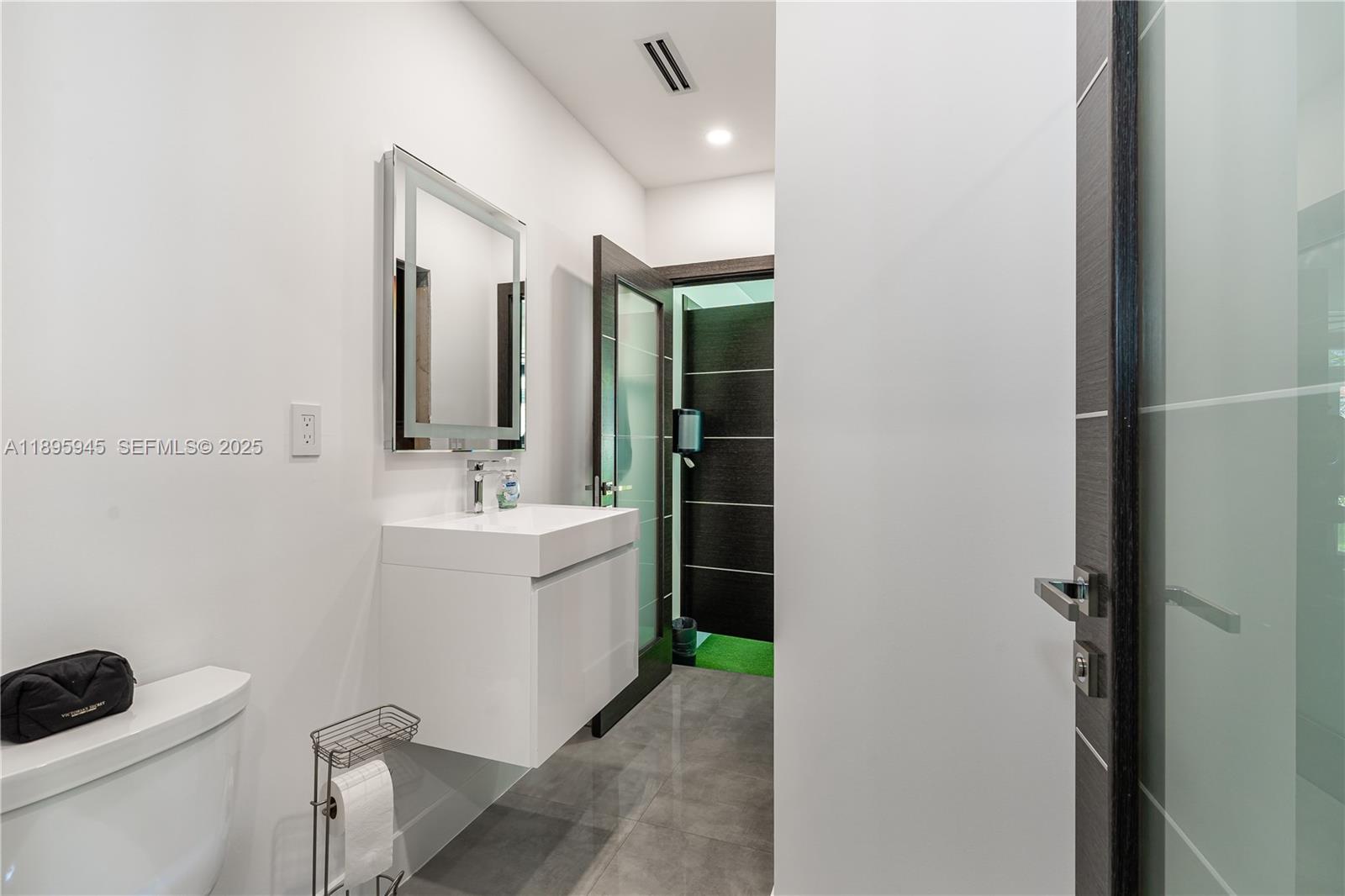 11531 Southwest 93rd Street Miami, FL 33176 - Photo 32 of 54 a bathroom with a sink a toilet and mirror