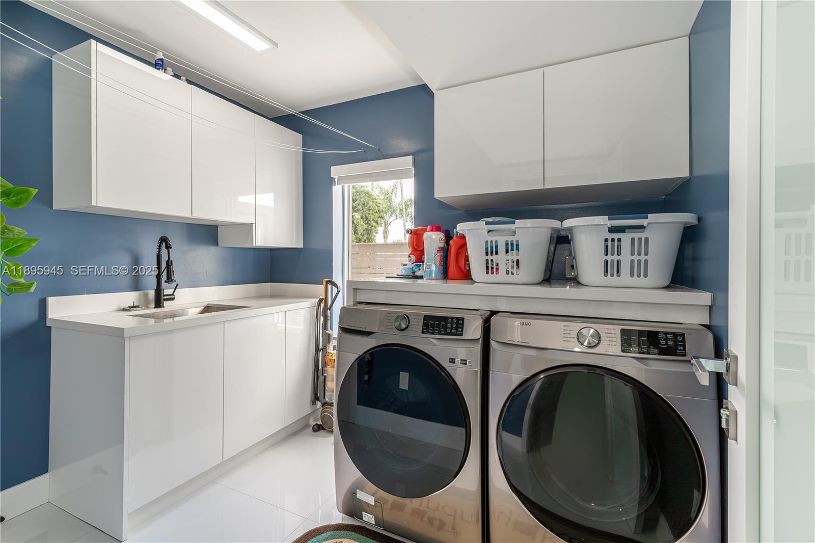 11531 Southwest 93rd Street Miami, FL 33176 - Photo 36 of 54 a utility room with sink dryer and washer