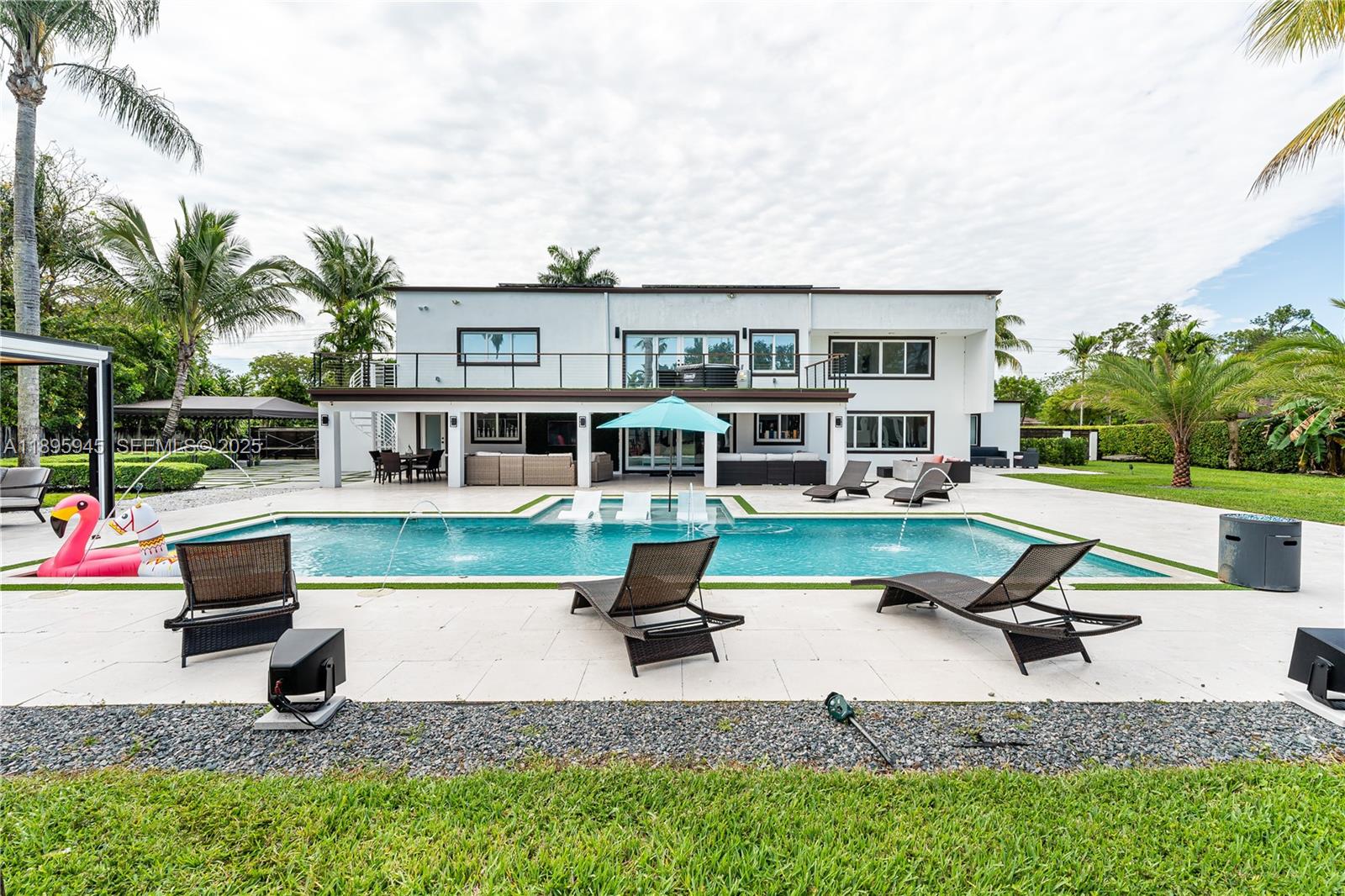 11531 Southwest 93rd Street Miami, FL 33176 - Photo 38 of 54 a house view with a sitting space and sitting space