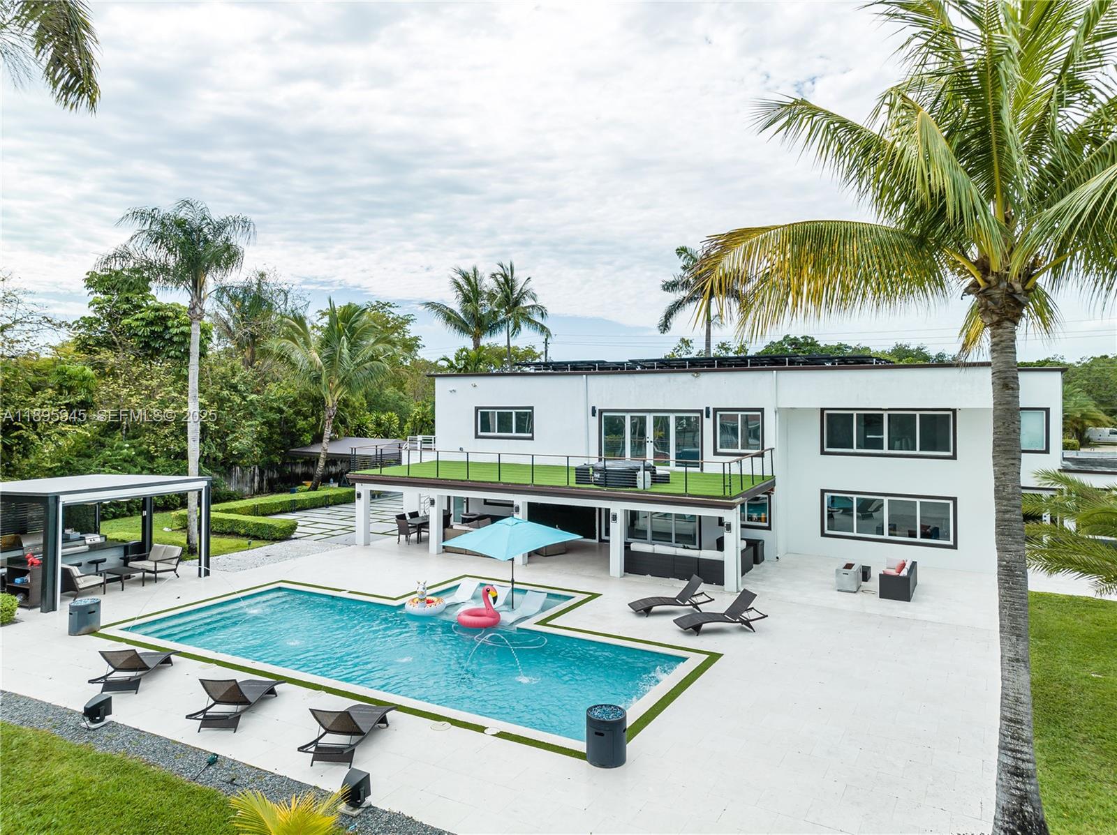 11531 Southwest 93rd Street Miami, FL 33176 - Photo 44 of 54 a view of a patio with swimming pool table and chairs