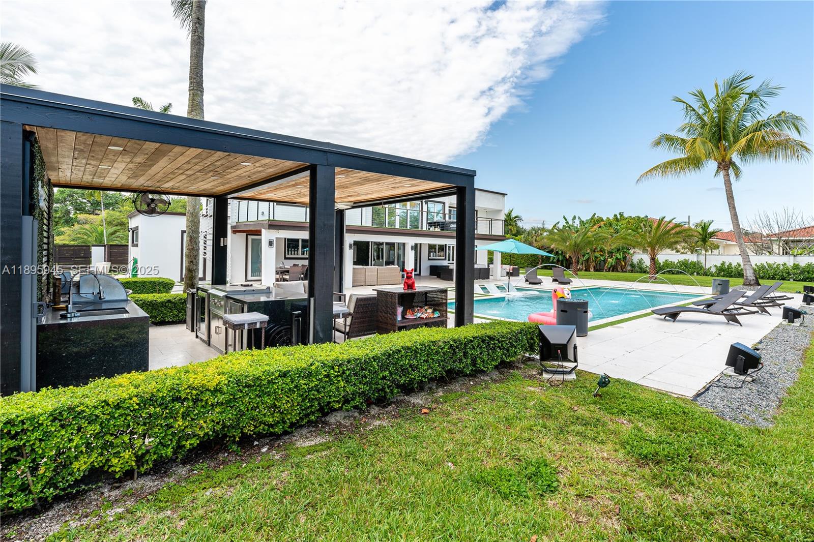 11531 Southwest 93rd Street Miami, FL 33176 - Photo 46 of 54 a garden view with a sitting space