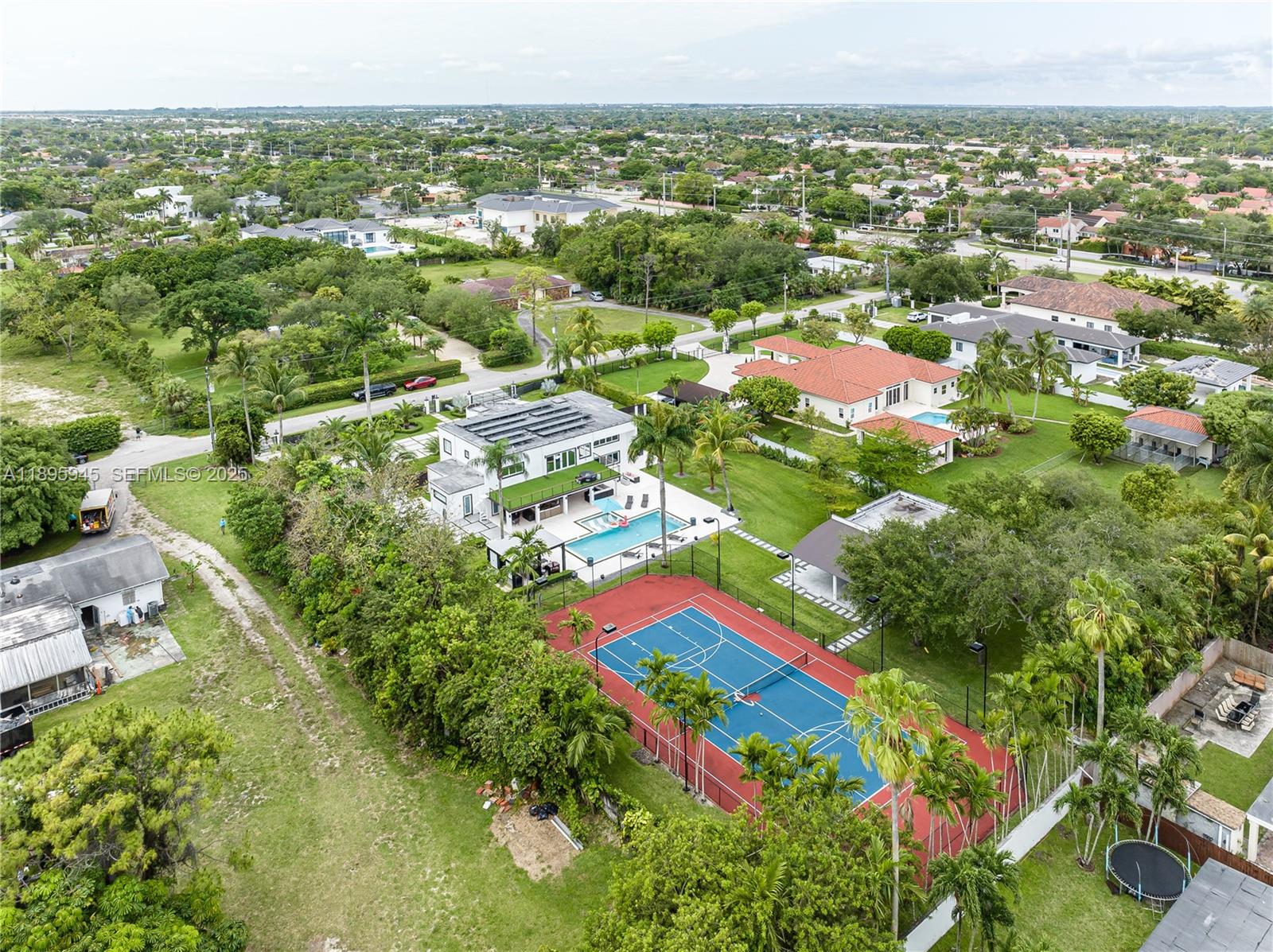 11531 Southwest 93rd Street Miami, FL 33176 - Photo 47 of 54 an aerial view of residential houses with outdoor space and trees