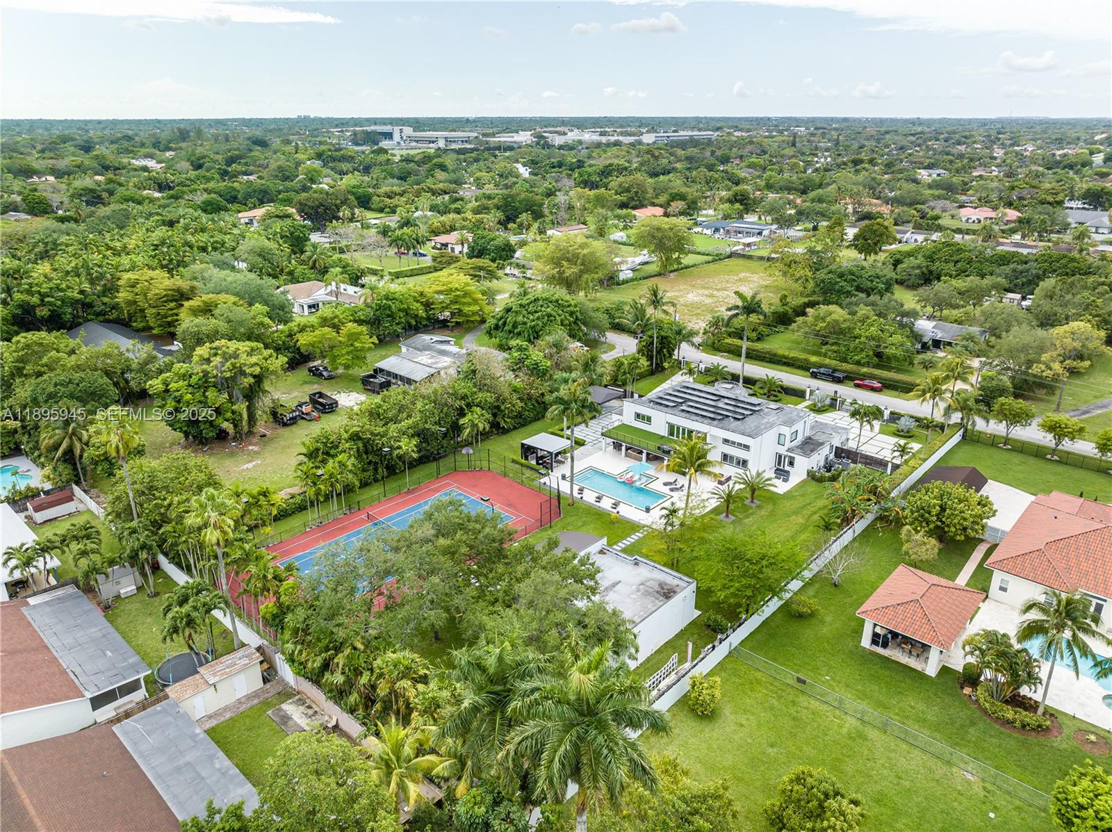 11531 Southwest 93rd Street Miami, FL 33176 - Photo 48 of 54 an aerial view of residential houses with outdoor space and trees