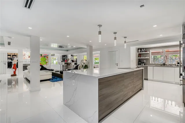 a large white kitchen with lots of counter space