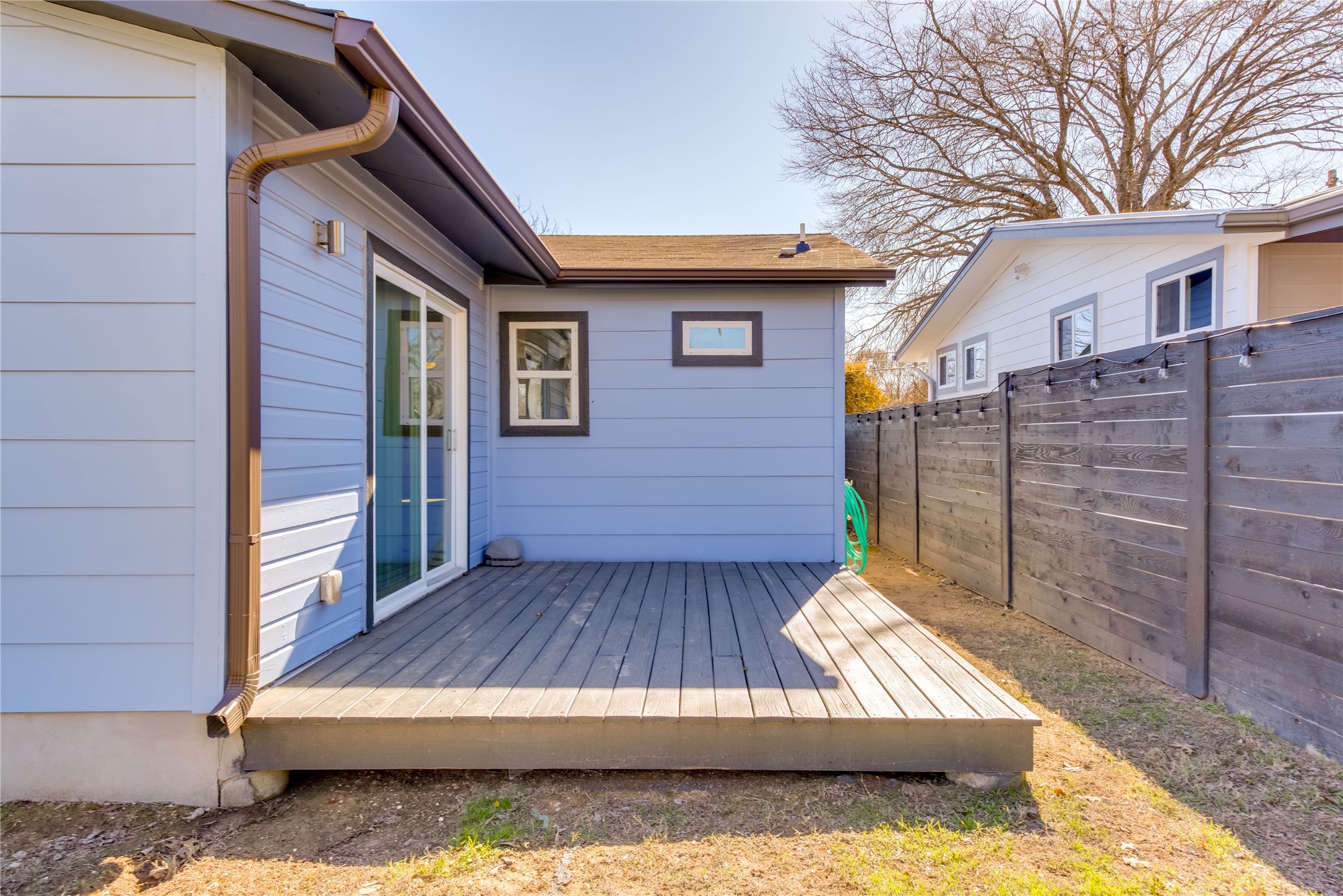 4702 Bandera Road Austin, TX 78721 - Photo 12 of 12 a view of backyard with wooden floor and fence