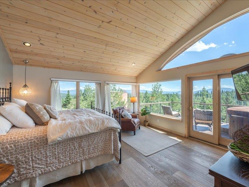 12386 Stockholm Way Truckee, CA 96161 - Photo 12 of 21 a bed room with a bed and a large window