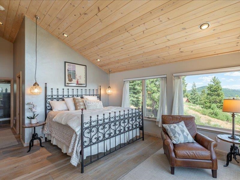 12386 Stockholm Way Truckee, CA 96161 - Photo 13 of 21 a bedroom with a bed and a couch