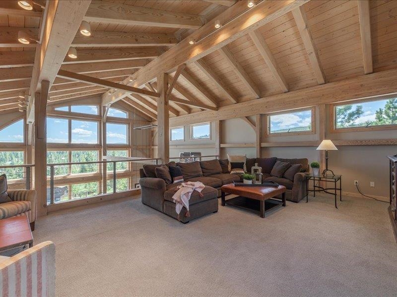 12386 Stockholm Way Truckee, CA 96161 - Photo 15 of 21 a living room with furniture and a floor to ceiling window