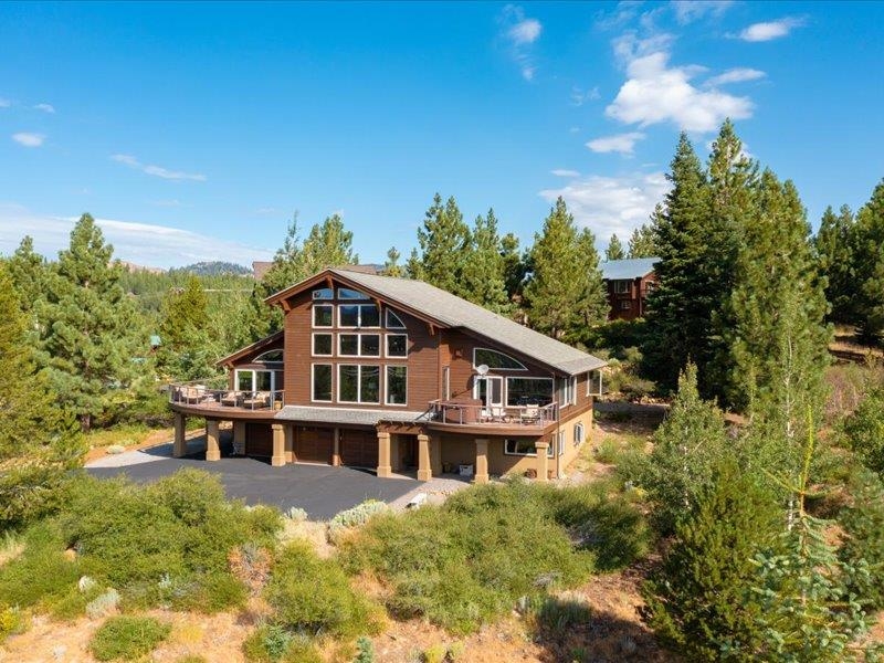 12386 Stockholm Way Truckee, CA 96161 - Photo 18 of 21 a house with trees in the background