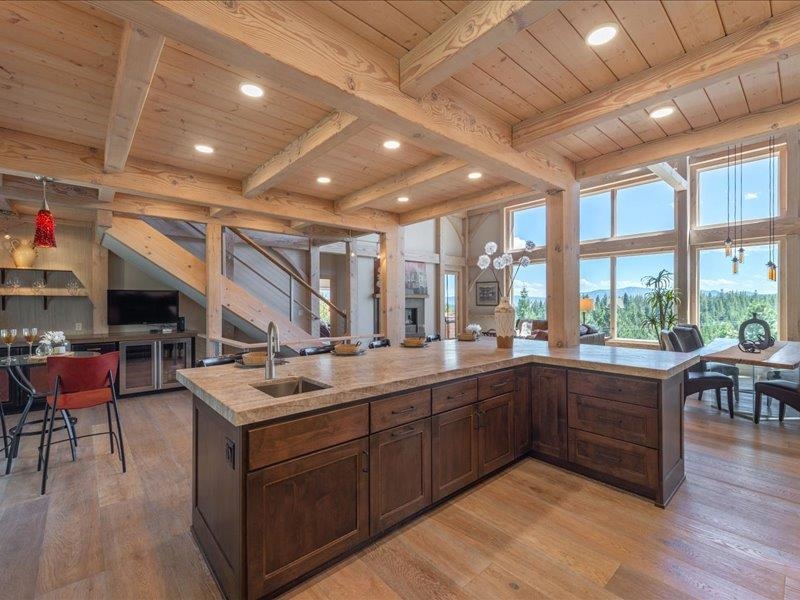 12386 Stockholm Way Truckee, CA 96161 - Photo 9 of 21 a large room with lots of furniture and wooden floors