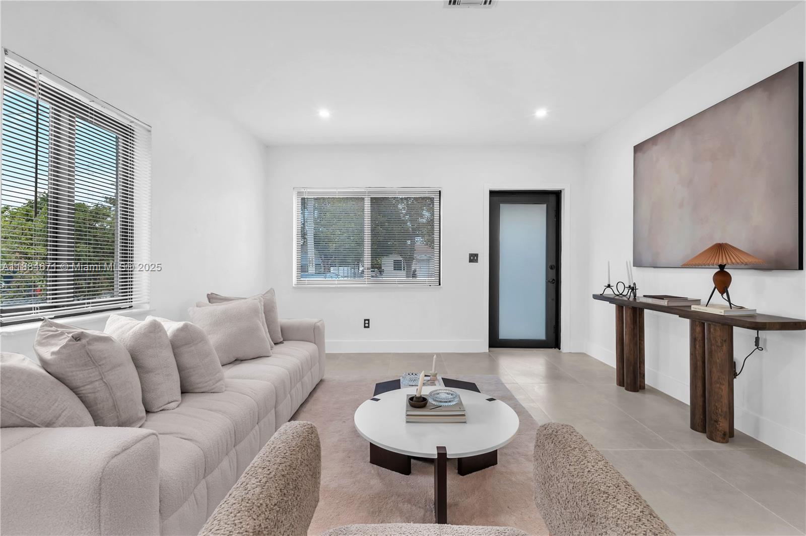 5250 Northwest 4th Street Miami, FL 33126 - Photo 15 of 41 a living room with furniture and a wooden floor
