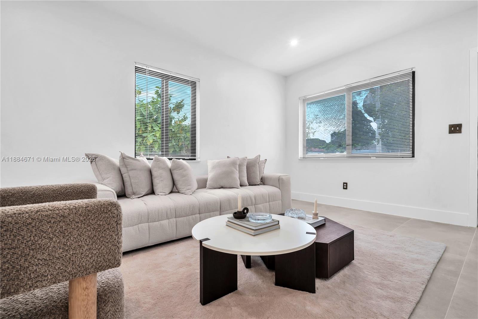 5250 Northwest 4th Street Miami, FL 33126 - Photo 16 of 41 a living room with furniture and a window