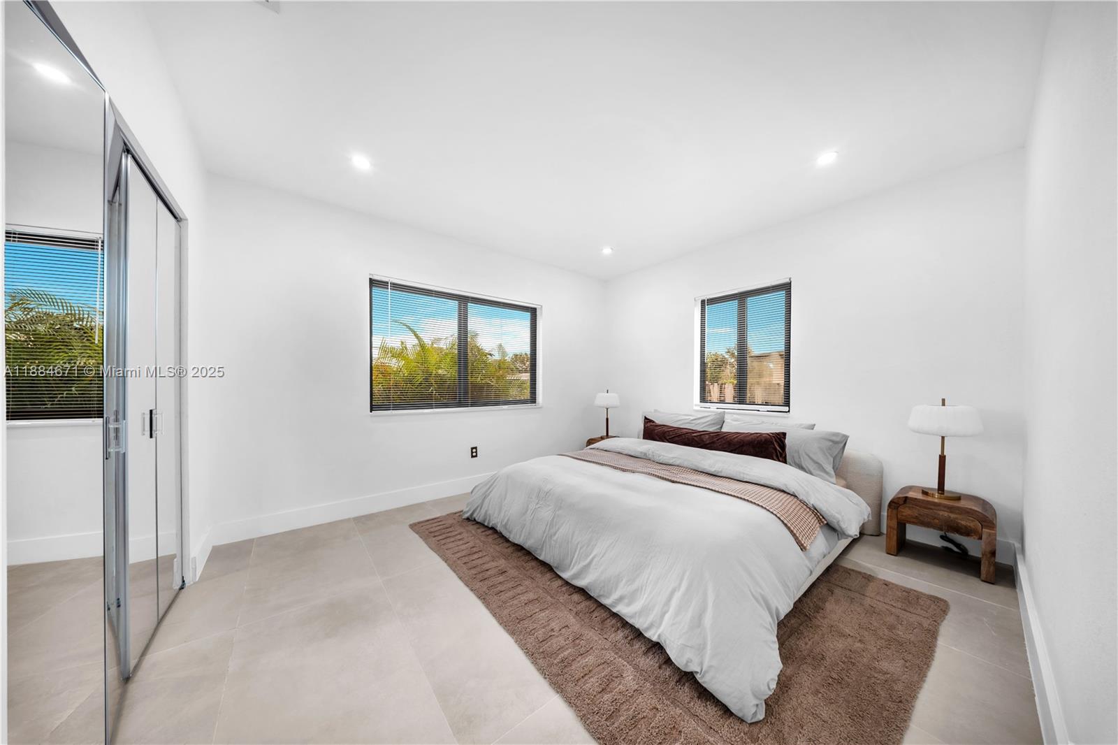 5250 Northwest 4th Street Miami, FL 33126 - Photo 17 of 41 a bedroom with a bed and a window