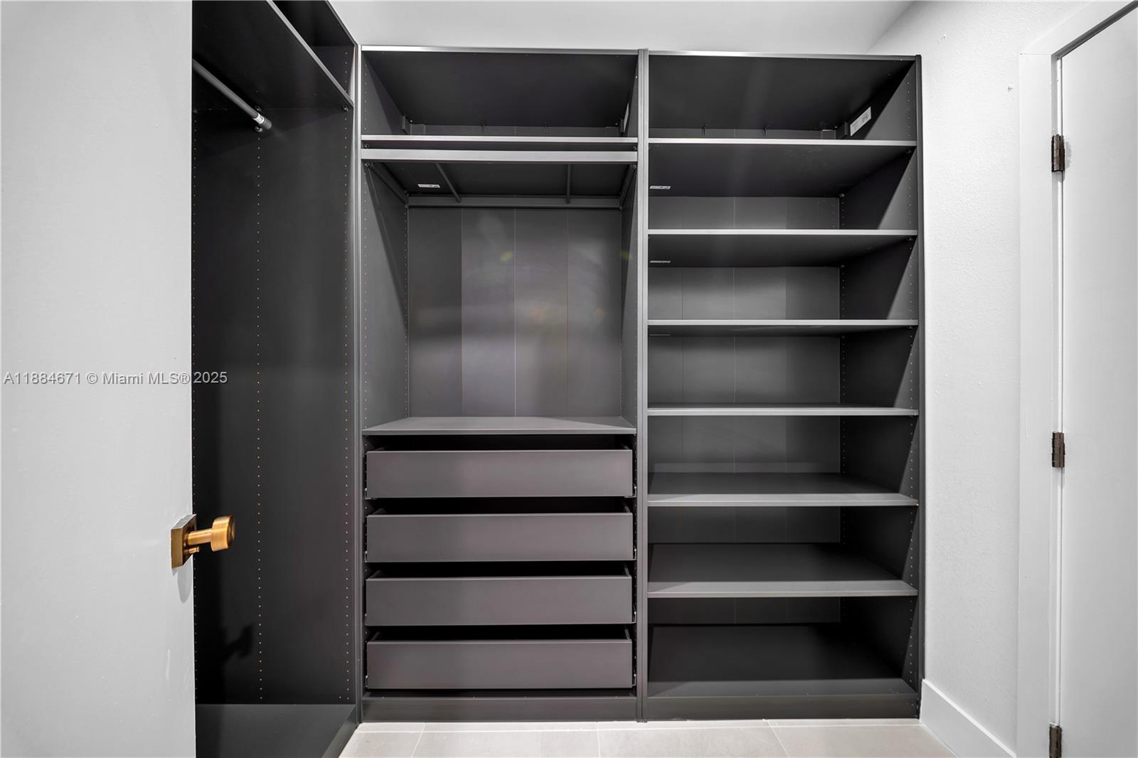 5250 Northwest 4th Street Miami, FL 33126 - Photo 22 of 41 a view of walk in closet with empty racks