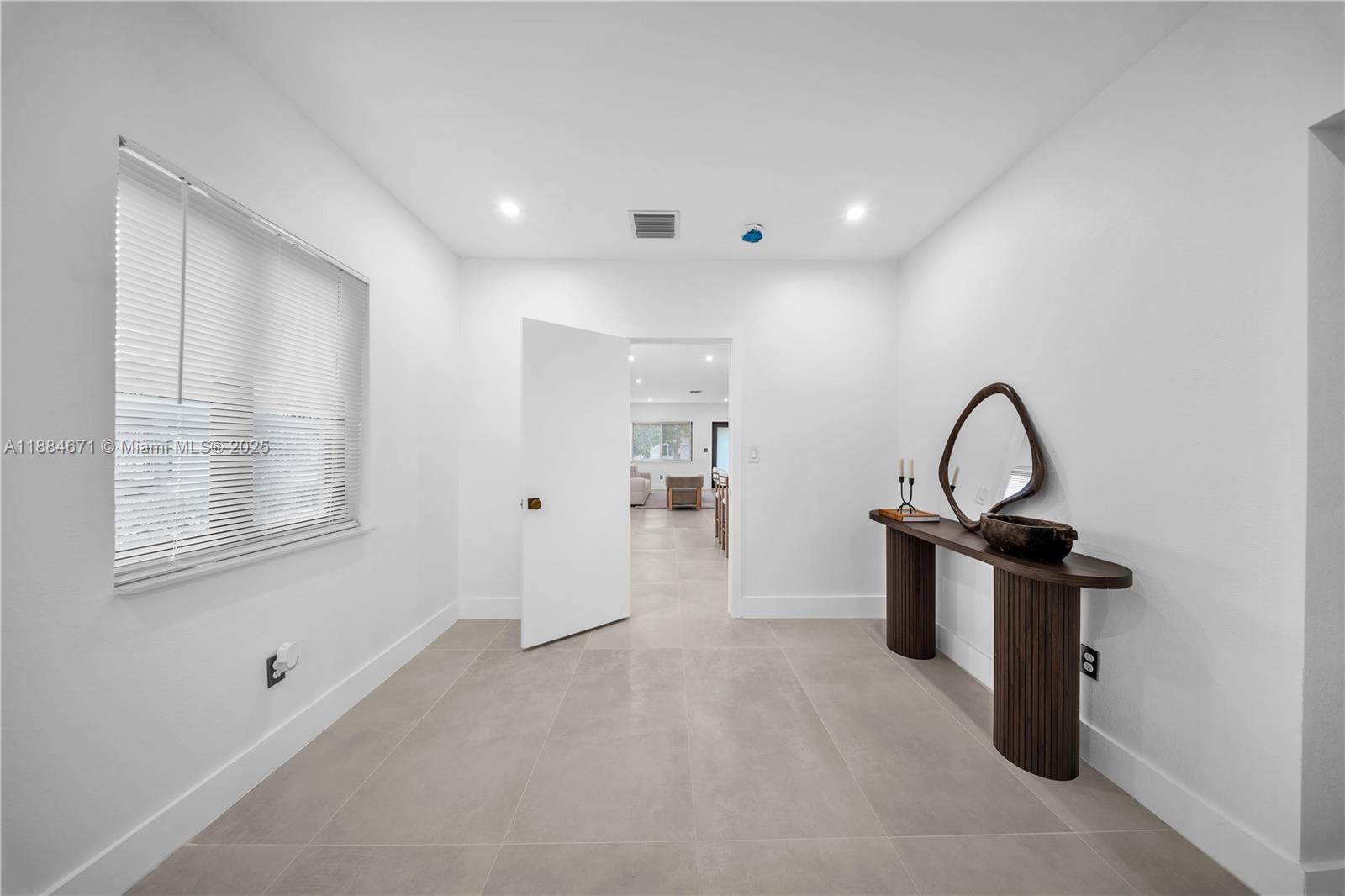 5250 Northwest 4th Street Miami, FL 33126 - Photo 25 of 41 a view of a room with wooden floor and window