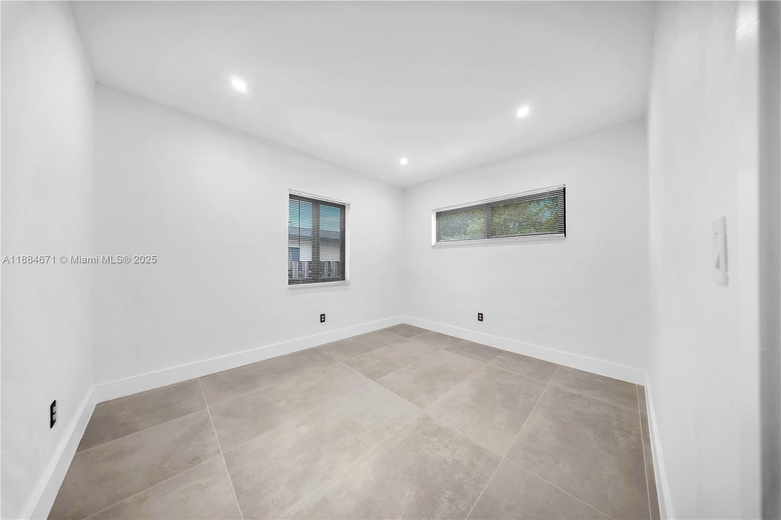 5250 Northwest 4th Street Miami, FL 33126 - Photo 30 of 41 an empty room with windows