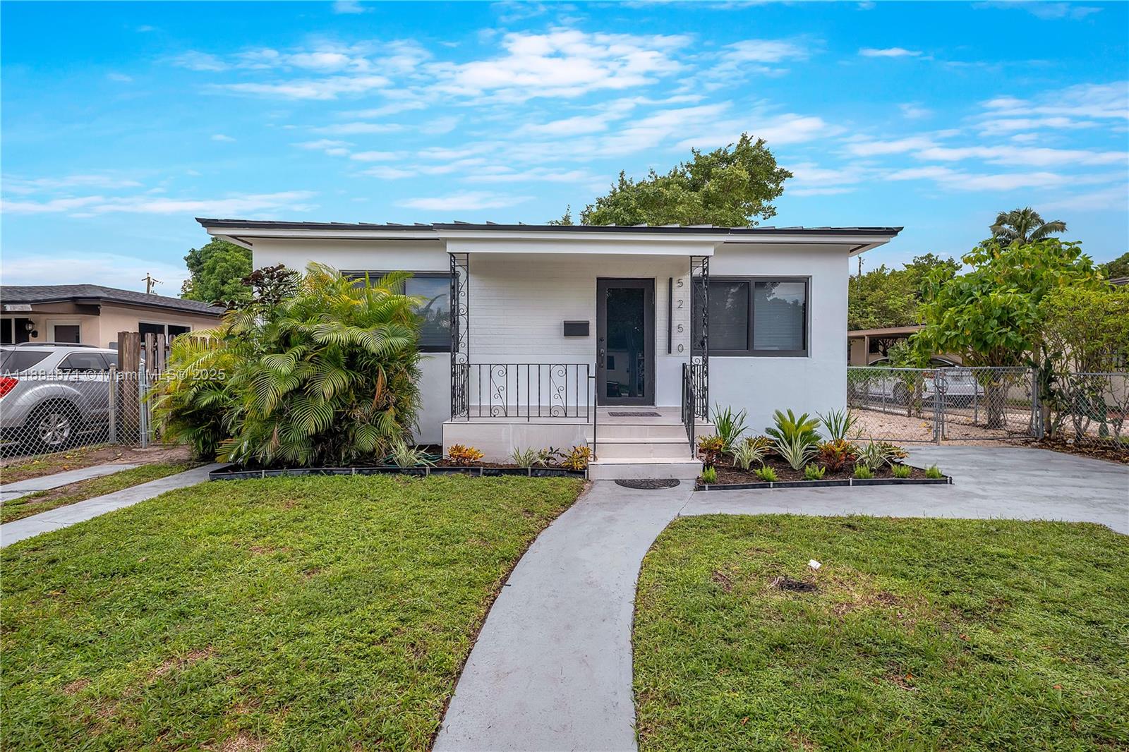 5250 Northwest 4th Street Miami, FL 33126 - Photo 35 of 41 a front view of a house with a yard