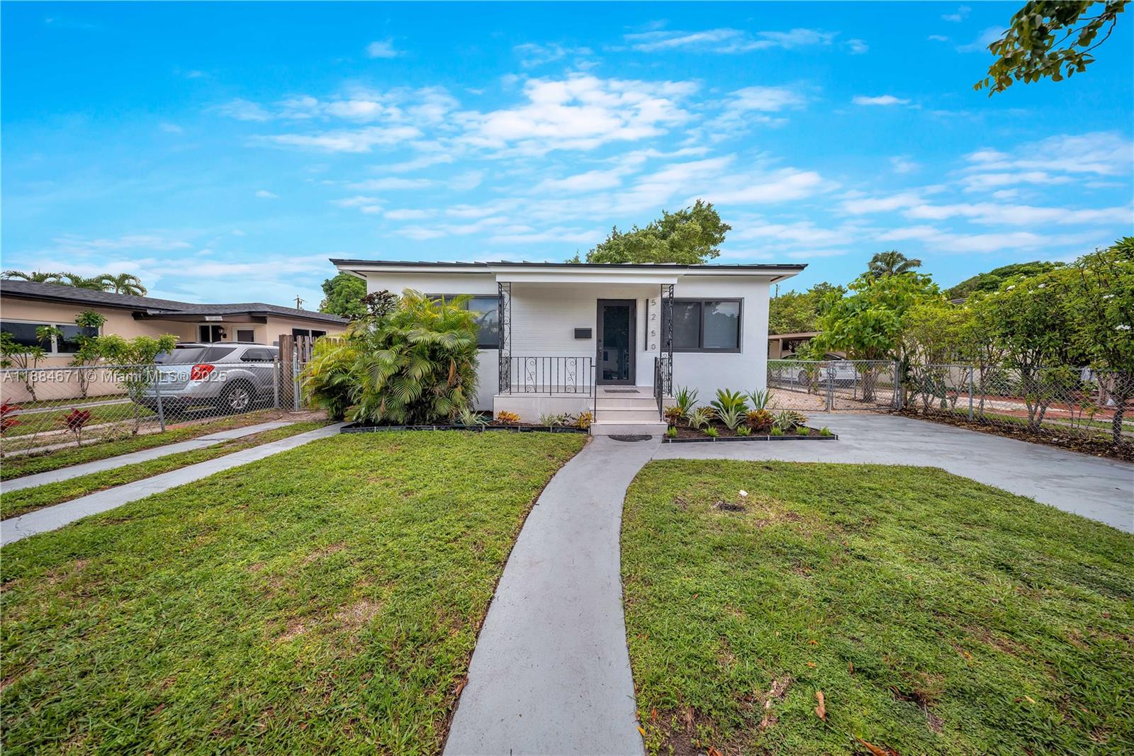 5250 Northwest 4th Street Miami, FL 33126 - Photo 37 of 41 a view of a patio with couches plants and large tree