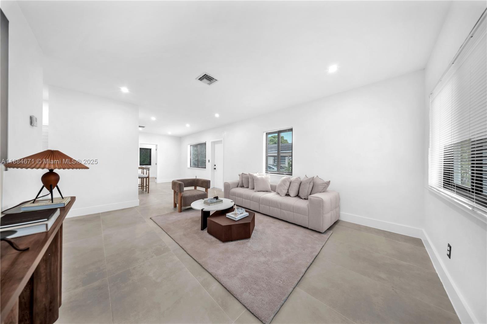 5250 Northwest 4th Street Miami, FL 33126 - Photo 10 of 41 a living room with furniture and a window