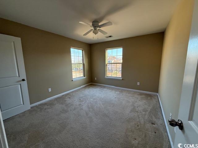 237 Golden Oaks Drive Murrells Inlet, SC 29576 - Photo 12 of 21 Spare room featuring carpet floors and ceiling fan