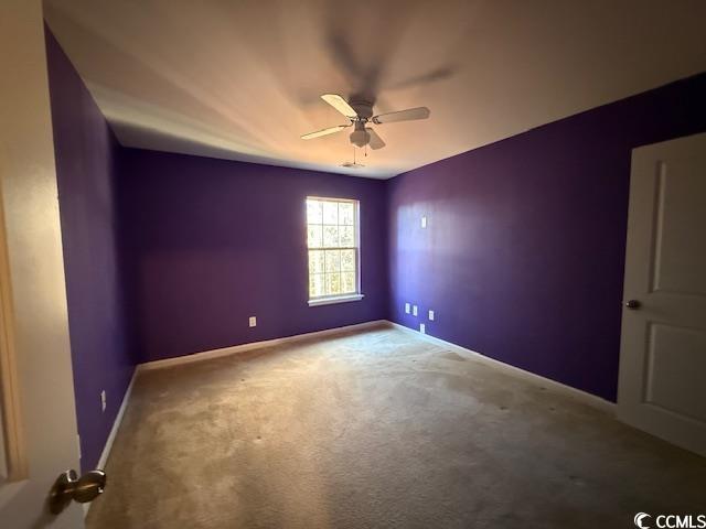 237 Golden Oaks Drive Murrells Inlet, SC 29576 - Photo 13 of 21 Unfurnished room with carpet floors and ceiling fan