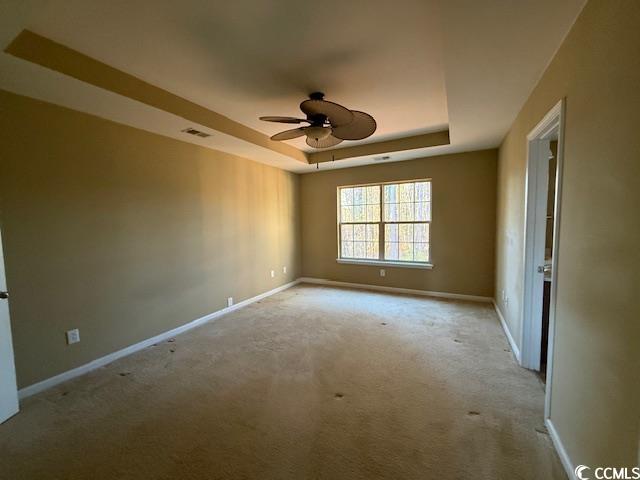 237 Golden Oaks Drive Murrells Inlet, SC 29576 - Photo 8 of 21 Primary bedroom featuring a tray ceiling, ceiling fan and on suite bath.