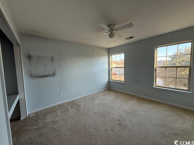 237 Golden Oaks Drive Murrells Inlet, SC 29576 - Photo 9 of 21 Spare room featuring ceiling fan and carpet