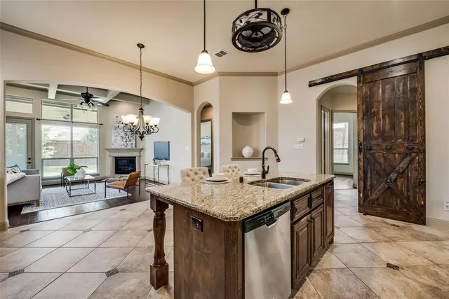 a kitchen with a counter space a sink appliances and cabinets