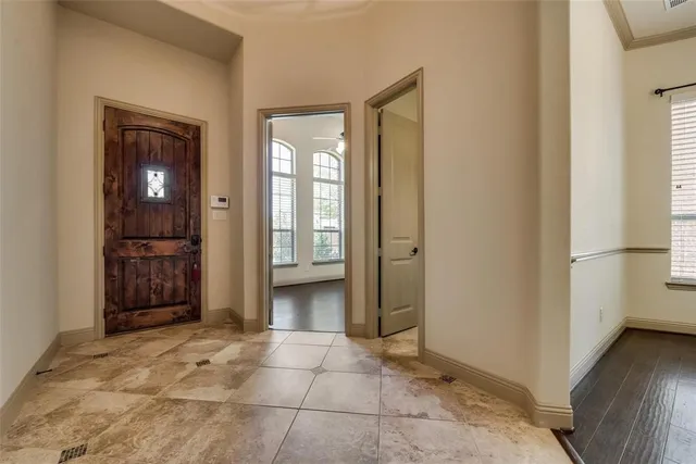 a view of a hallway with wooden shelves