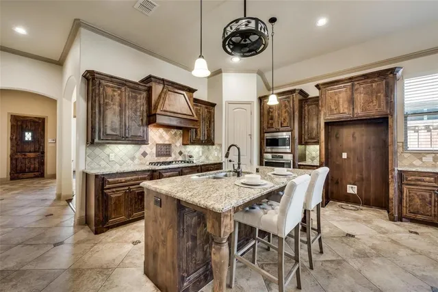 a kitchen with a table and chairs in it