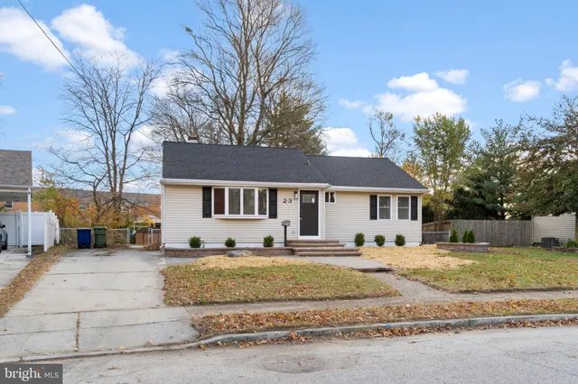 a house that has a tree in front of it