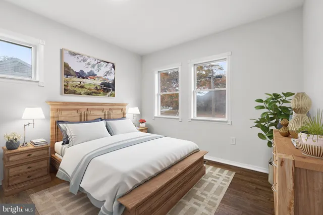 a bedroom with bed and window