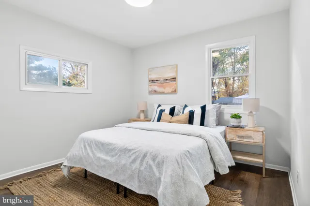 a bed room with a bed and a window