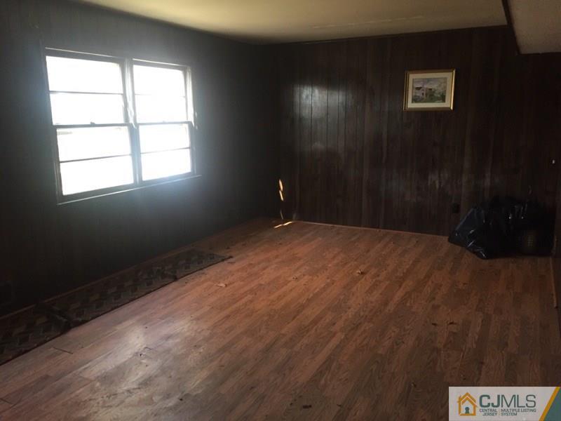 29 Roxy Avenue Edison, NJ 08820 - Photo 3 of 11 a view of empty room with windows