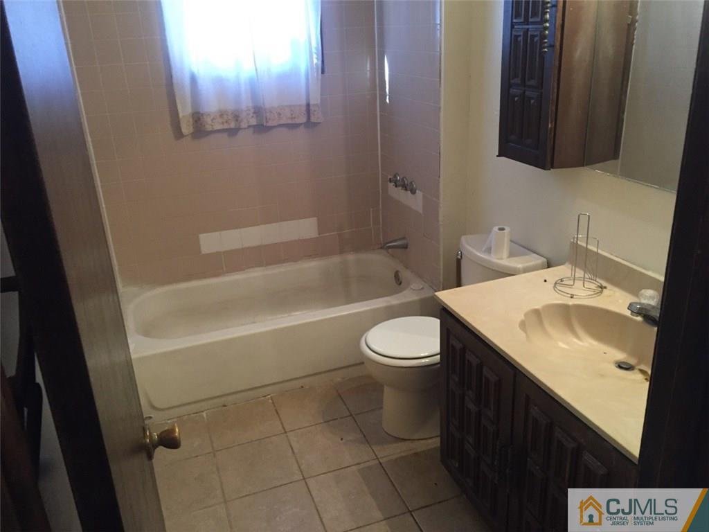 29 Roxy Avenue Edison, NJ 08820 - Photo 9 of 11 a bathroom with a sink toilet and shower
