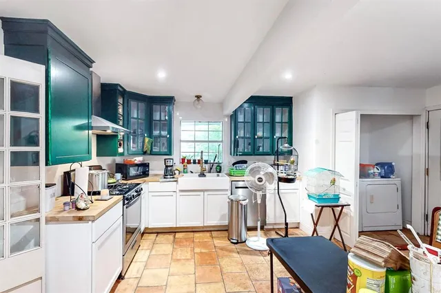 a living room with lots of furniture and a chandelier