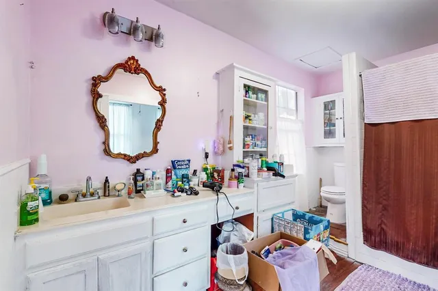 a living room with furniture a flat screen tv and a large window