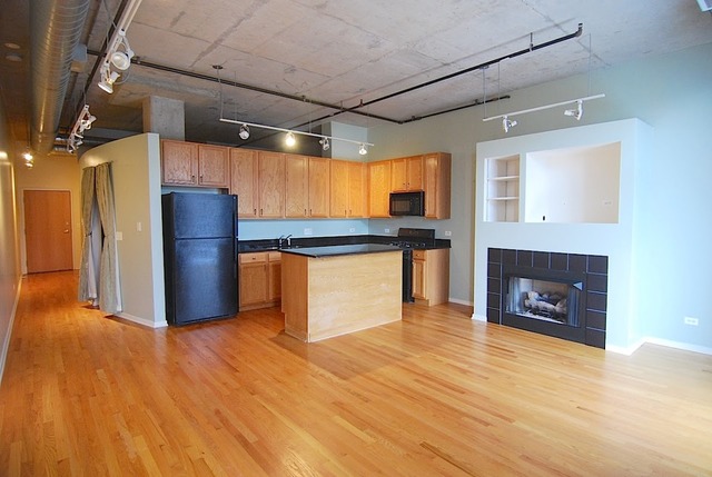 1000 West Adams Street, Unit 719 Chicago, IL 60607 - Photo 2 of 9 a view of a livingroom with a fireplace