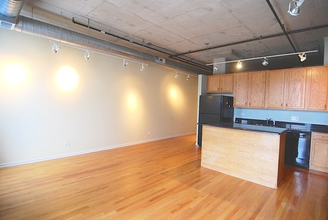 1000 West Adams Street, Unit 719 Chicago, IL 60607 - Photo 4 of 9 a view of a room with wooden floor