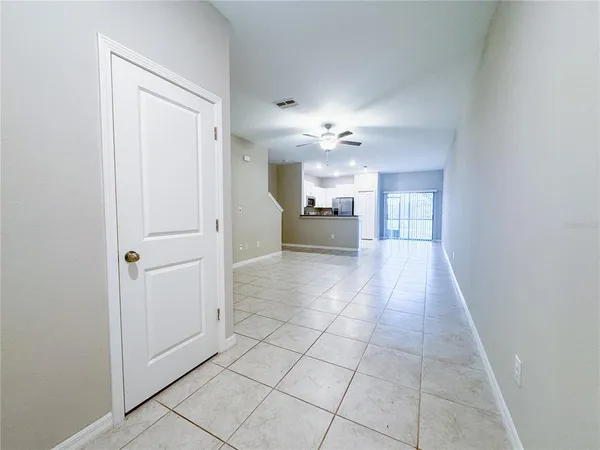 a spacious bathroom with a mirror and a shower