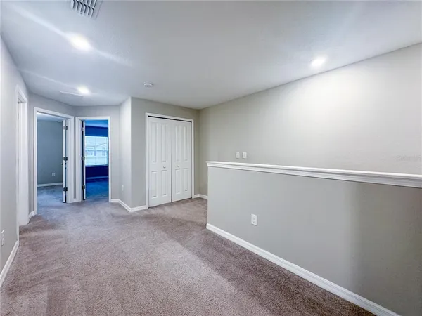 an empty room with closet area
