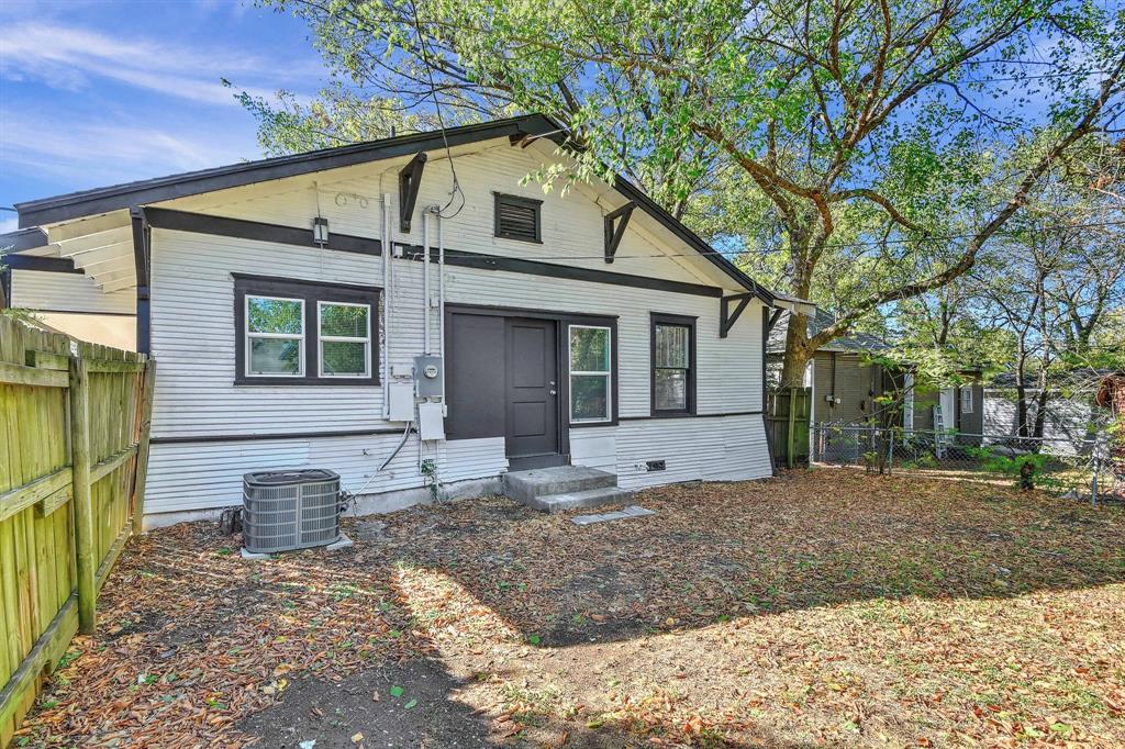 1115 South Rusk Avenue Denison, TX 75020 - Photo 20 of 21 a view of a house with a yard and tree