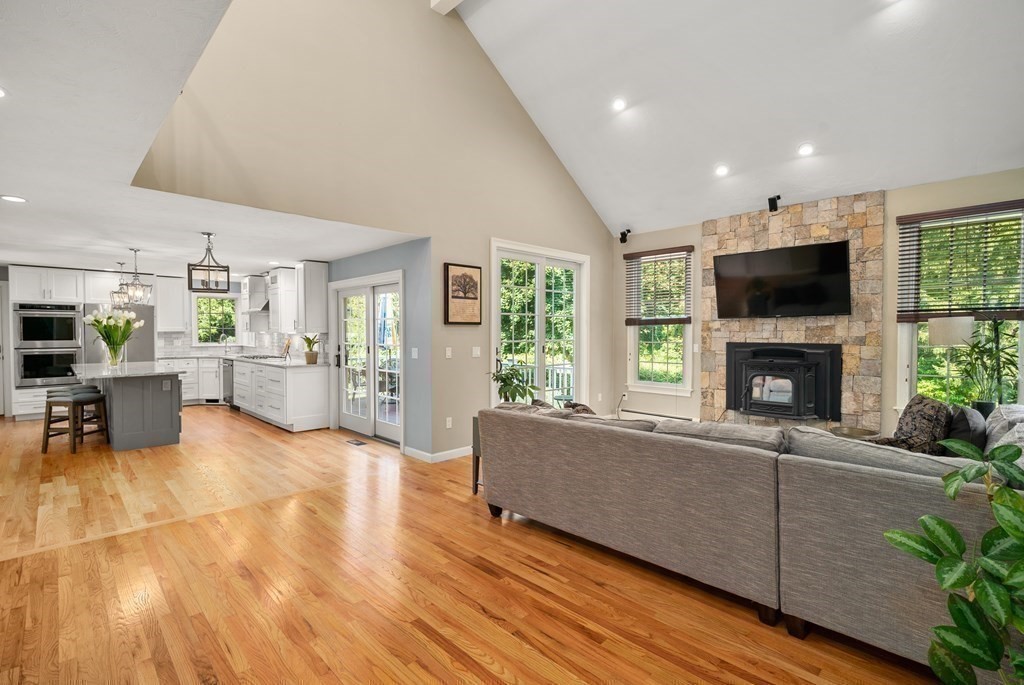1 Barnbridge Circle Framingham, MA 01701 - Photo 14 of 42 a living room with furniture a fireplace and a flat screen tv
